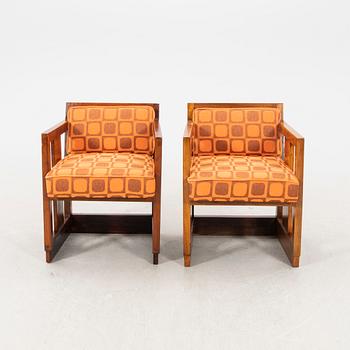 A pair of similar stained wood art déco armchairs from the first half of the 20th century.