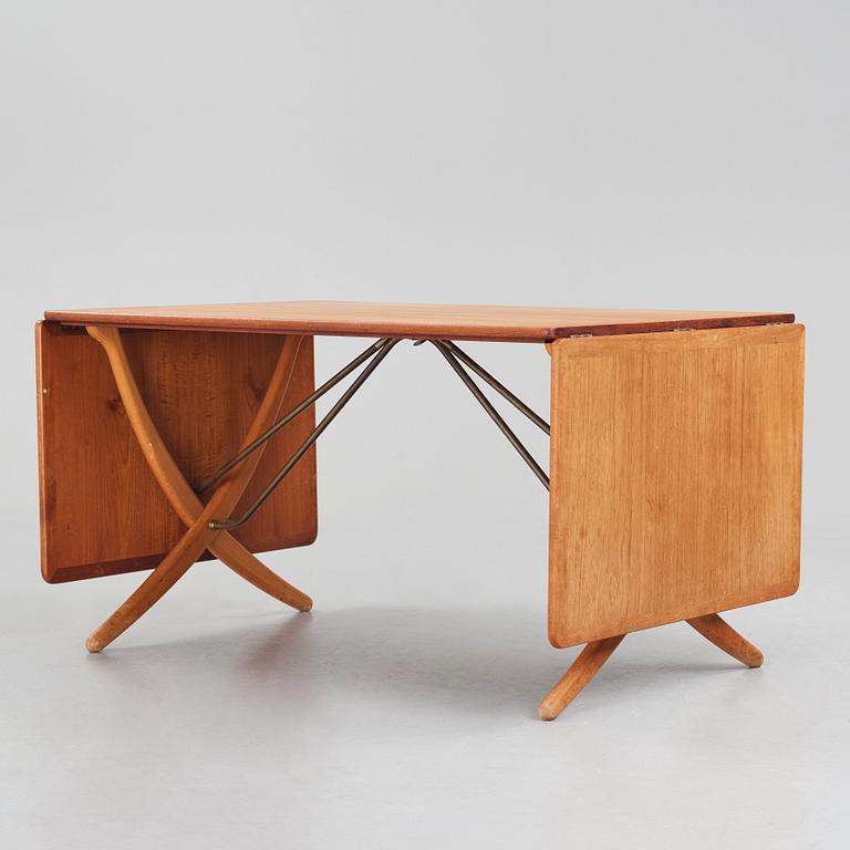 Hans J. Wegner, a teak, beech and brass dining table model 'AT-314' for Andreas Tuck, Denmark 1950-60s.