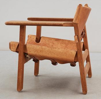 A Børge Mogensen oak and leather 'Spanish Chair' by Fredericia Stolefabrik, Denmark.