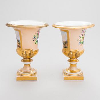 A pair of German porcelain urns from around the mid-19th century.