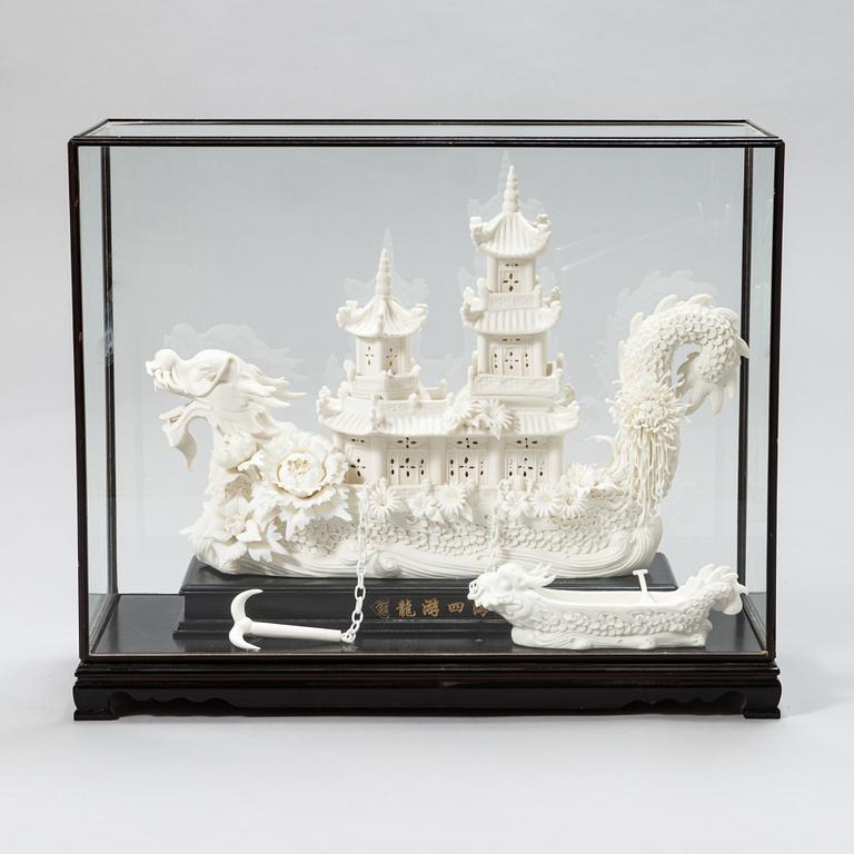 An oriental Boat sculpture in porcelain.