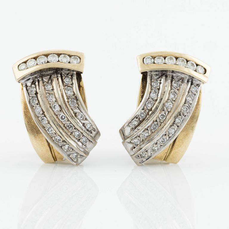 Gold earrings with brilliant-cut and octagon-cut diamonds.