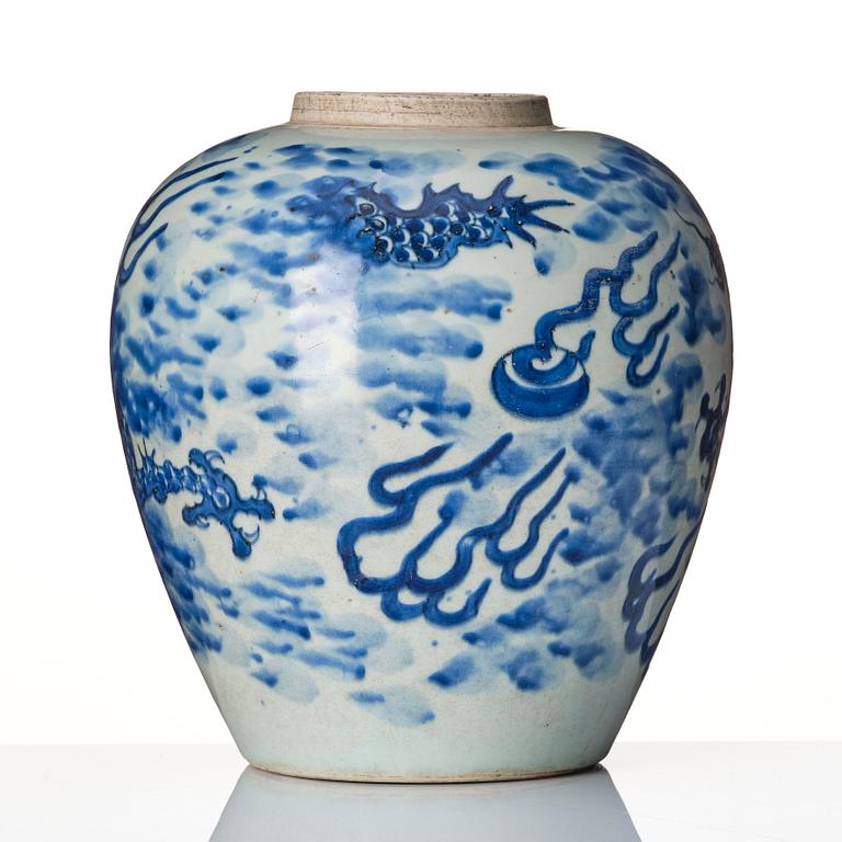 A blue and white Transitional jar with a four clawed dragon, 17th Century.