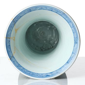 A Chinese blue and white celadon-ground beaker vase, Qing dynasty, Kangxi (1662-1722).