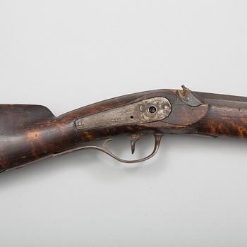 A mid 19th century percussion rifle.