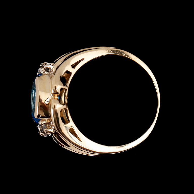 RING, 14 k guld, turkosblå topas ca 2.10 ct, diamanter tot ca 0.08 ct.