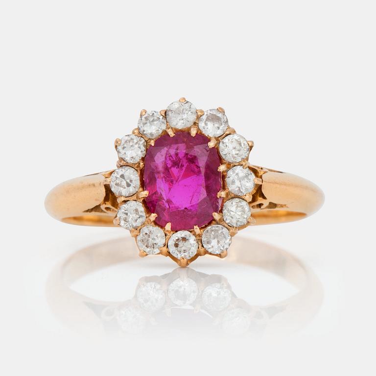 A ring set with oval, mixed-cut, untreated ruby surrounded by old cut diamonds.