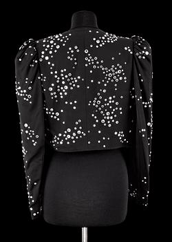 A black bolero by Yves Saint Laurent.