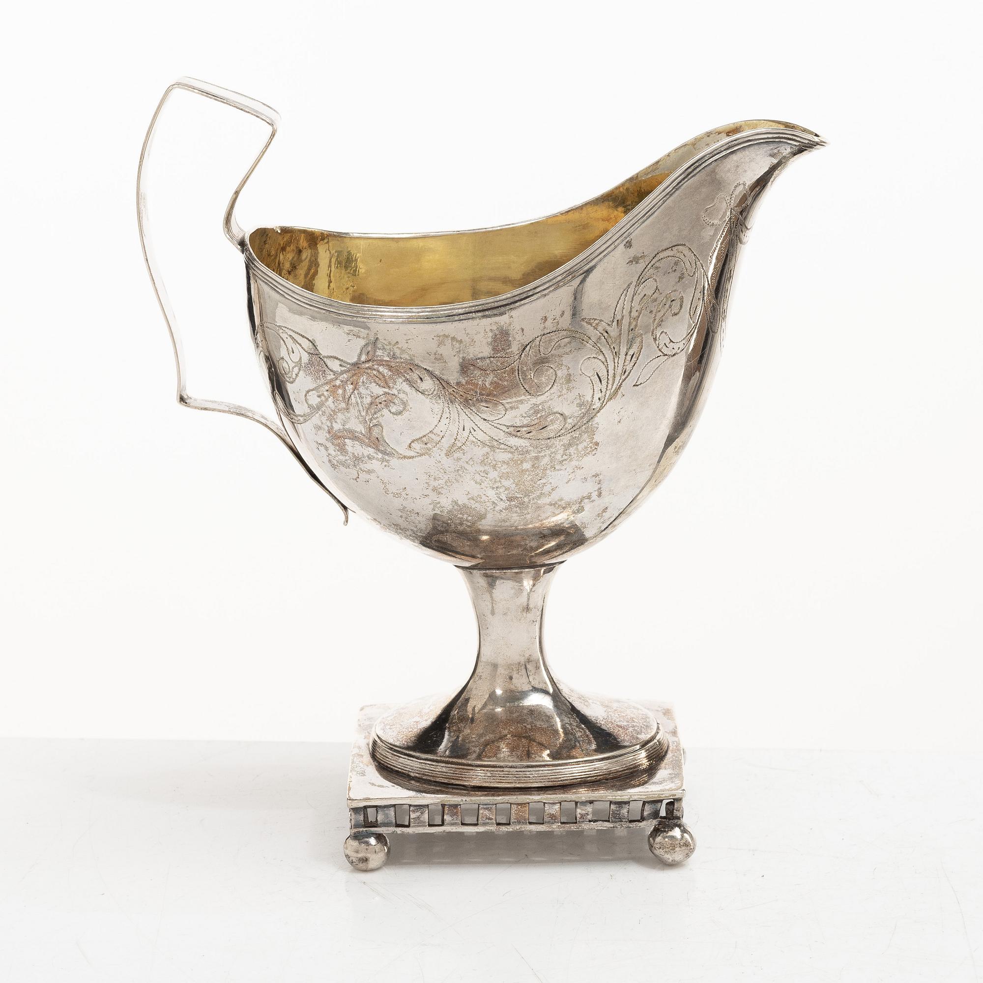 A Swedish Gustavian parcel-gilt silver sauce jug, mark of Daniel Hallman, Stockholm 1810.
