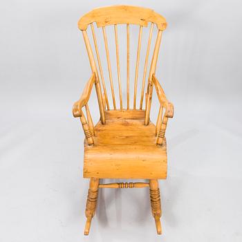 A Wooden Rocking Chair.