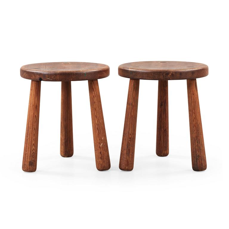 Axel Einar Hjorth, a pair of stained pine 'Utö' stools, Nordiska Kompaniet, Sweden ca 1930.