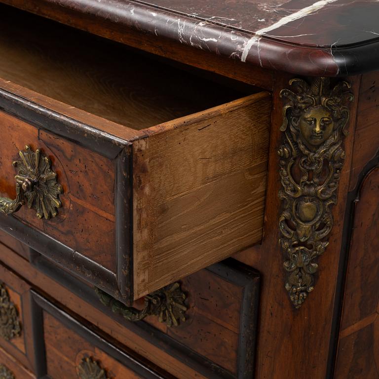 A 20th century French Regence style commode.