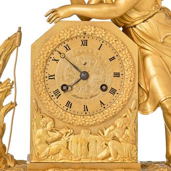 A French Empire ormolu and patinated bronze mantel clock, Paris, early 19th century.