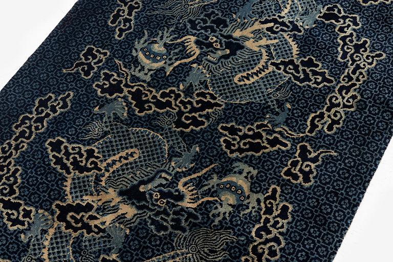 A Chinese 'dragon' rug, circa 1920. (c 190x122 cm).
