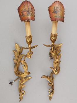 A pair of Louis XV style 20 th Century wall sconces.