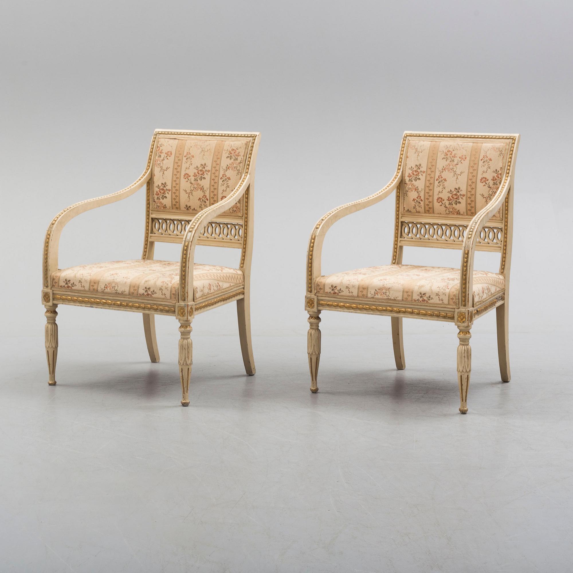 A pair of first half of the 19th century Empire arm chairs.