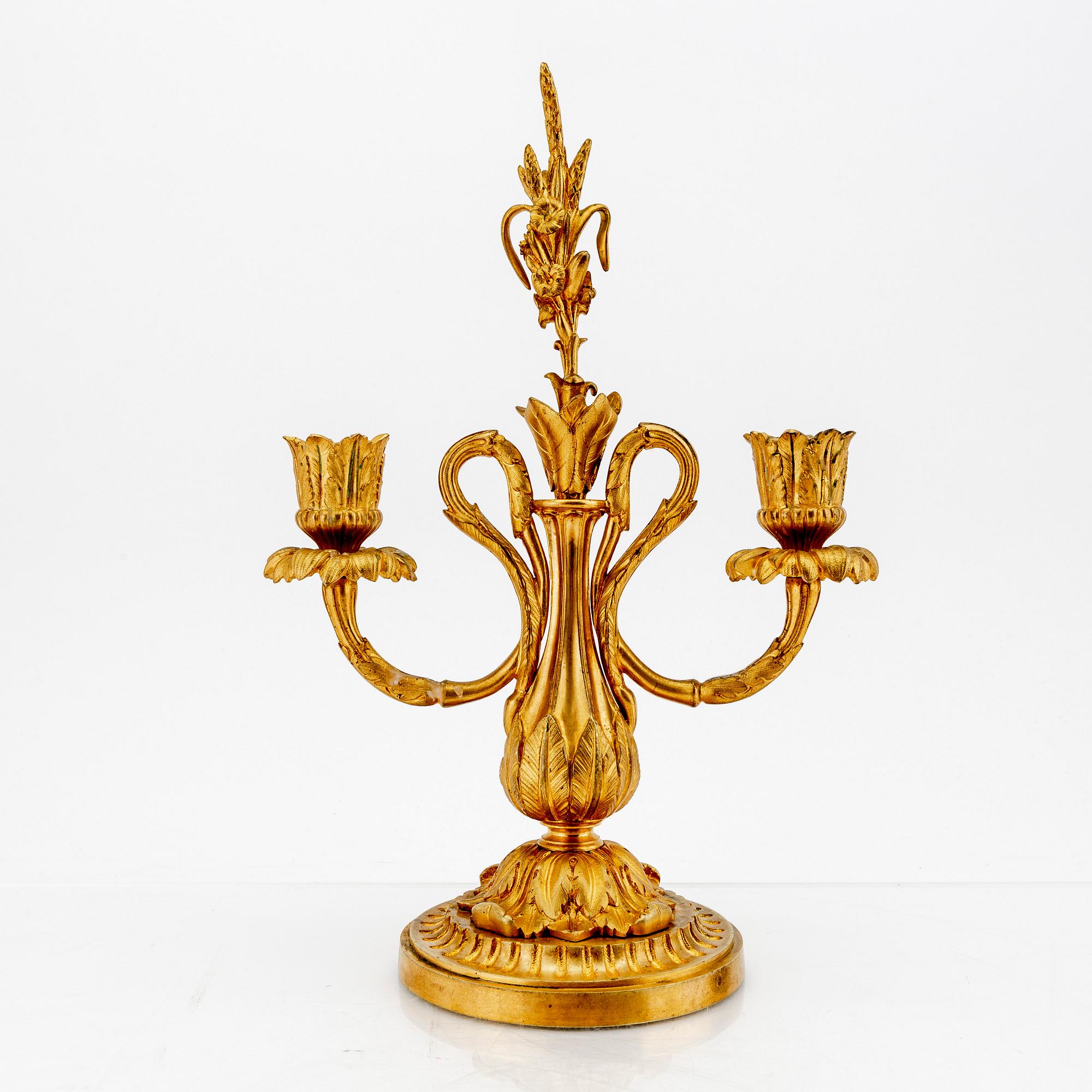 A pair of Louis XV-style bronze candelabras.