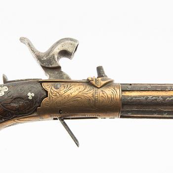 A British percussion pistol, 19th century.