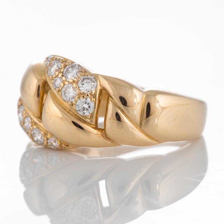 A Cartier ring in 18K gold set with round brilliant-cut diamonds.