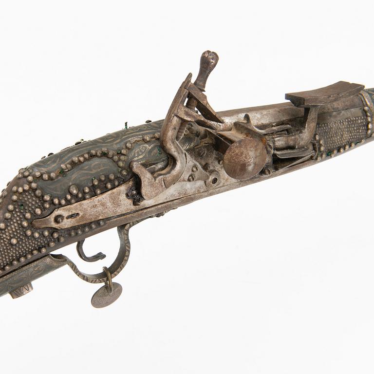 A 19th Century North African flint lock rifle.