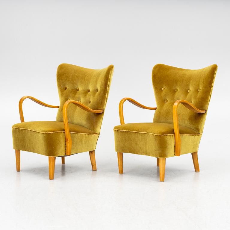 A pair of wingback armchairs, Sweden, first half of the 20th century.
