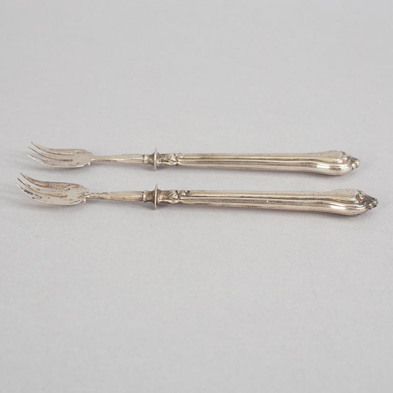 A set of twelve French 19th century silver oyster forks, mark of Hippolyte Thomas, Paris.