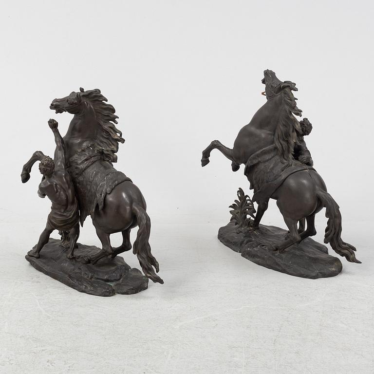 Guilliaume Coustou, after, a pair of bronze sculptures.