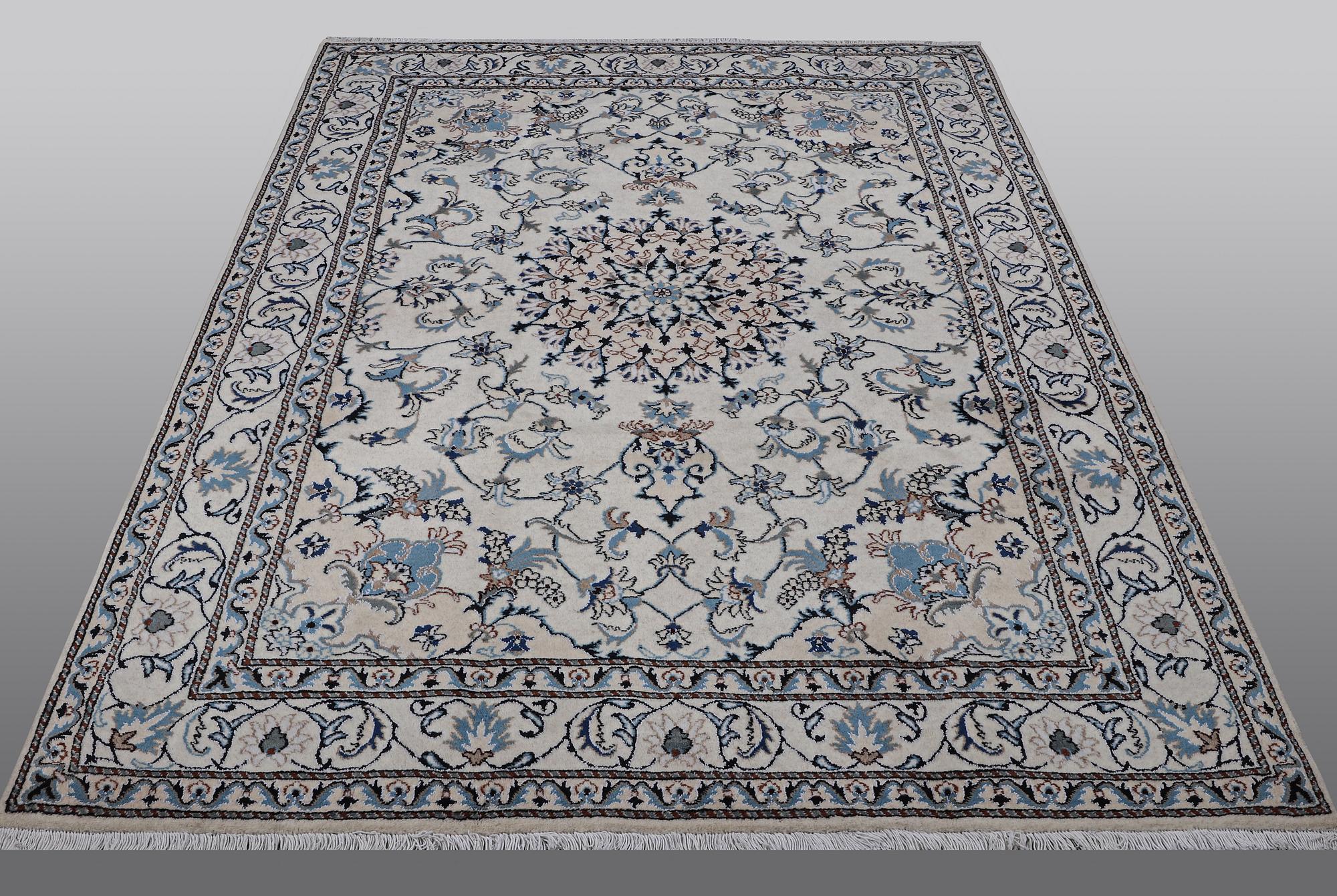 A rug, Nain, part silk, 238 x 163 cm.