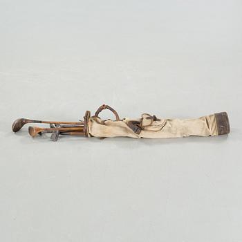 Seven golf clubs with bag, clubs by by "J Winton" & "Josh Taylor",, first half of the 20th century.