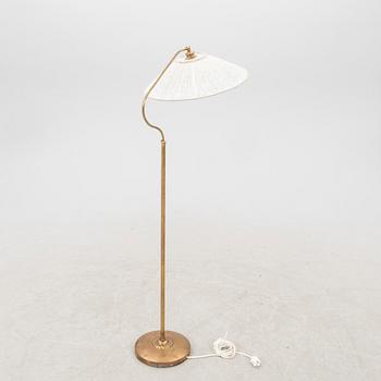 A 1940s brass  floor lamp.