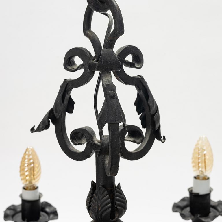 A black painted iron chandelier,