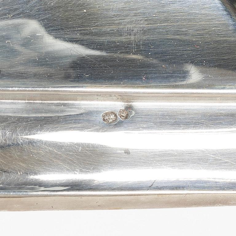 A pair of silver candelabras, with Swedish import marks, possibly mid20th century.