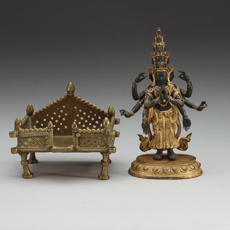 A gilt bronze figure of eleven-faced Avalokiteshvara, Tibet/Nepal, 19th Century.