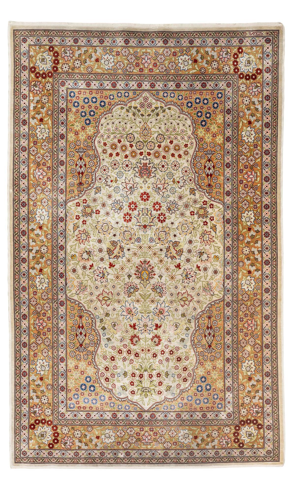 A double-nisch silk Hereke rug, c. 125 x 78 cm.