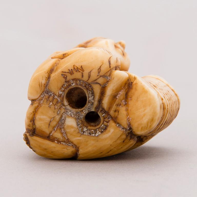 A 19th century Japanese bone netsuke.
