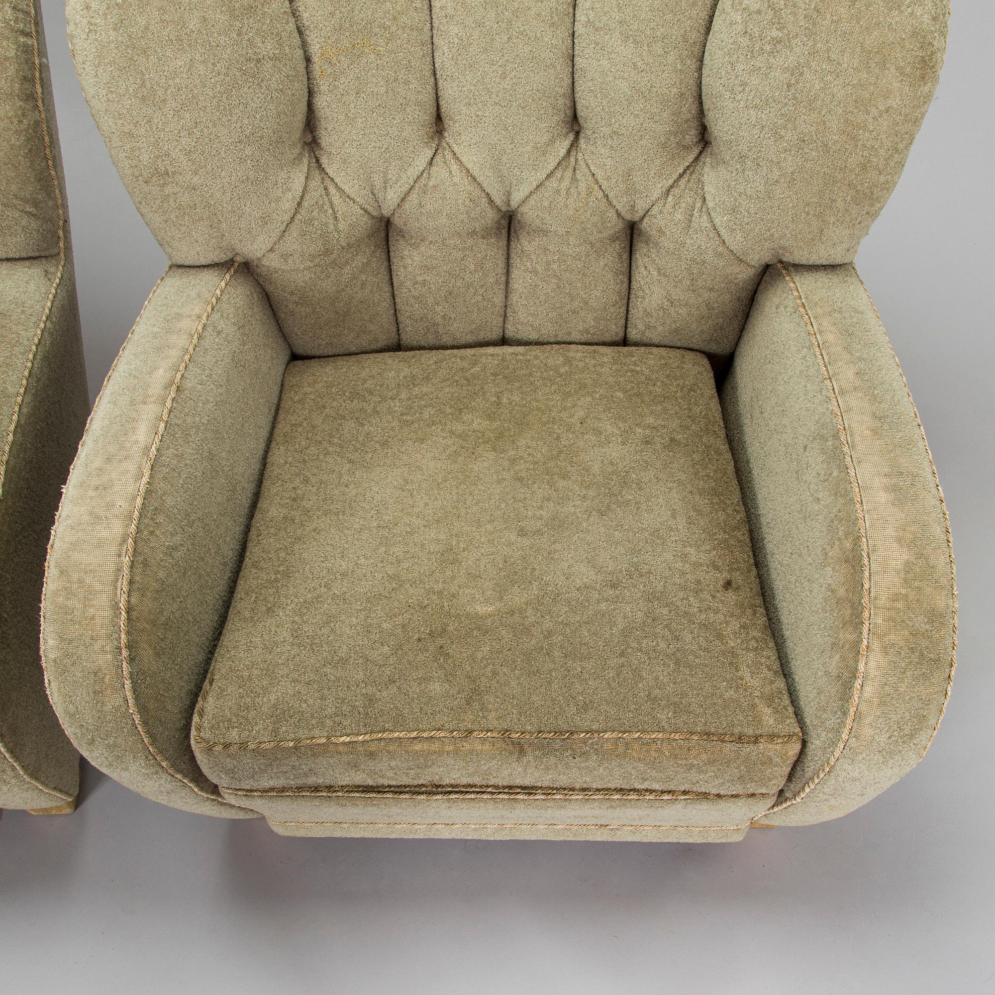 A pair of mid-20th century armchairs.