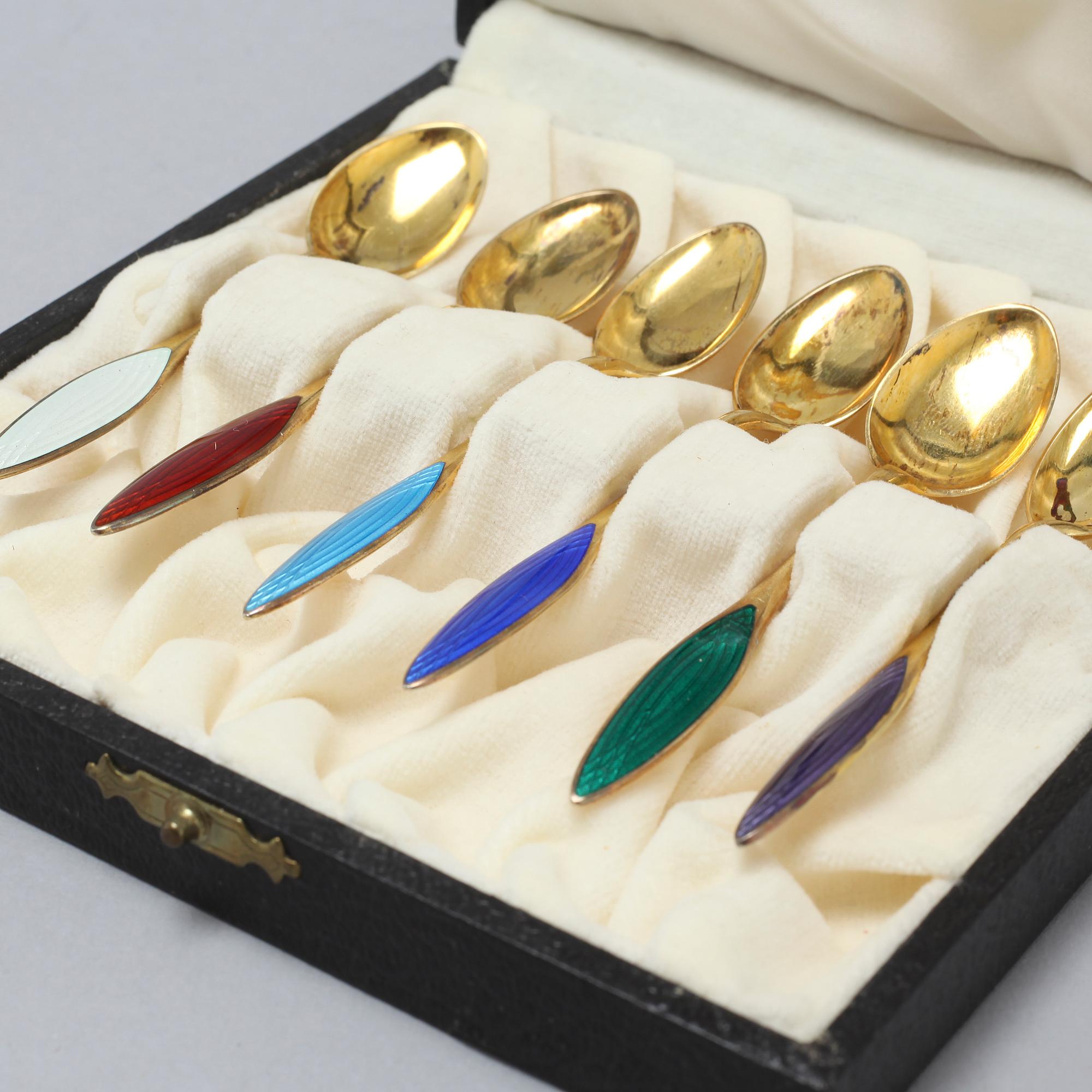 12 gilded silver spoons and small forks from Norway, around the mid 20th century.