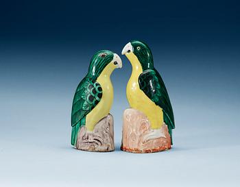 A set of two green and yellow glazed parrots, Qing dynasty, Jiaqing (1796-1820).