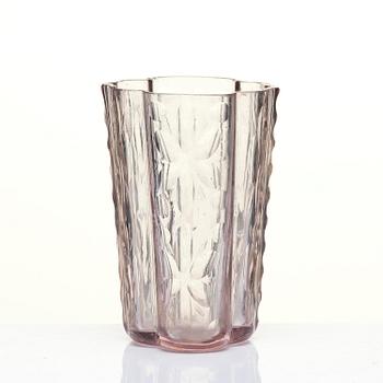 An amethyst coloured suger shaker and a cut glass goblet, 18th century.