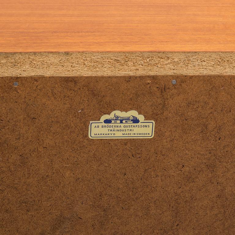 A 1950s teak veneer chest of drawers.