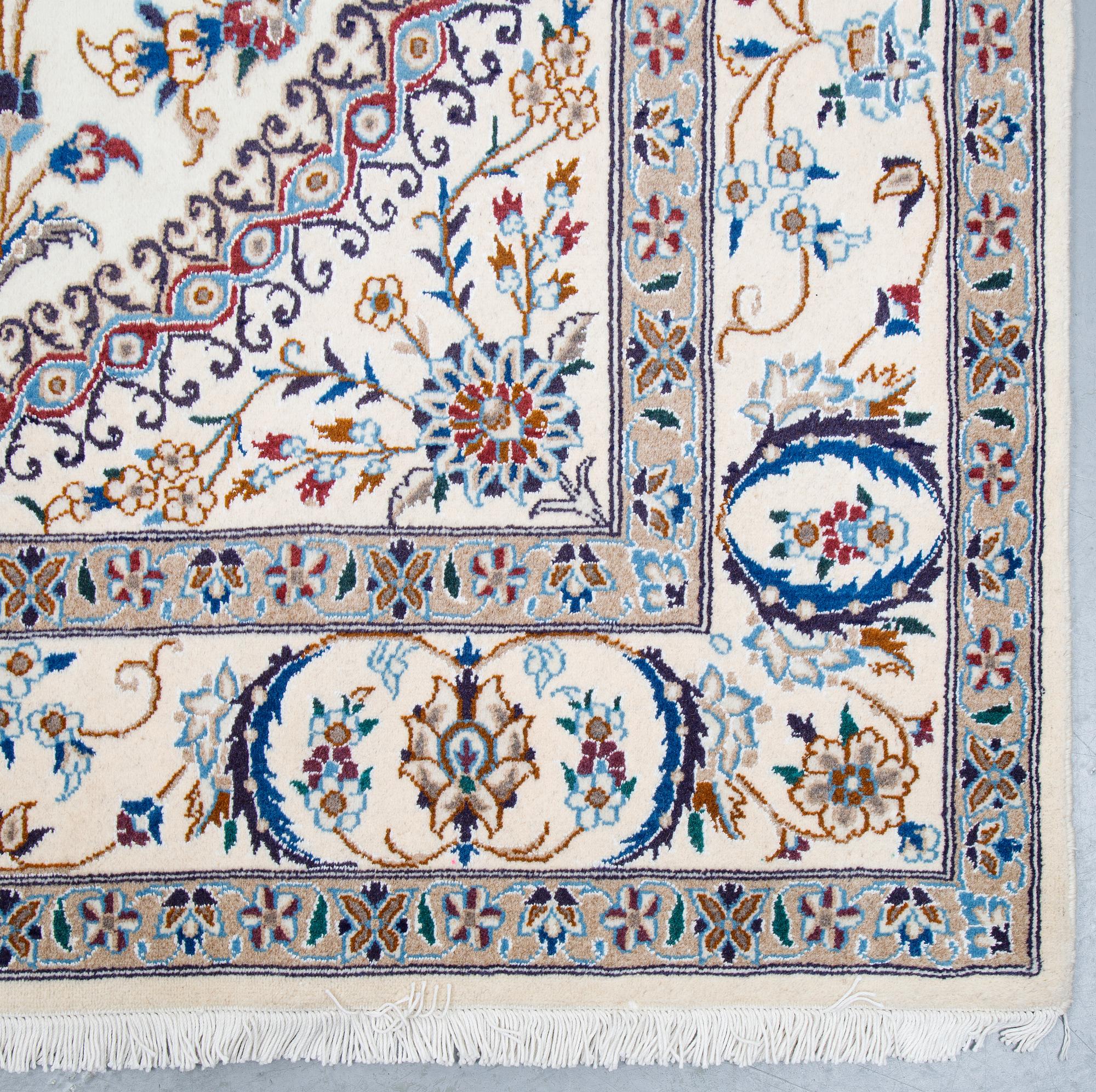 A carpet, Nain, part silk, ca 296 x 192 cm.