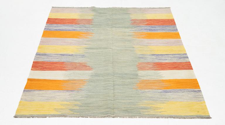 A kilim rug, ca 252 x 175 cm.