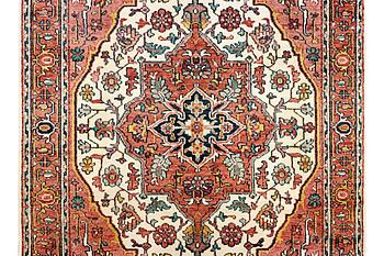 An oriental carpet with Mamluk design, c. 367 x 280 cm.