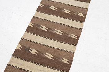 A Persian kilim runner, c. 248 x 62 cm.