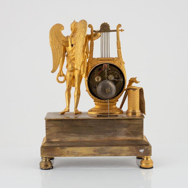 A French Empire ormolu figural mantel clock, early 19th century.