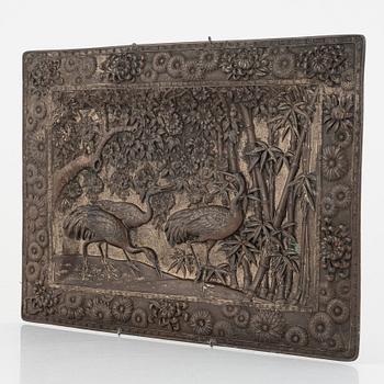 A Chinese copper relief, 20th century.