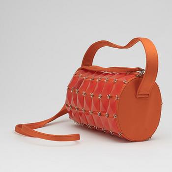 GIANNI VERSACE, a pair of orange lady's shoes and a handbag.