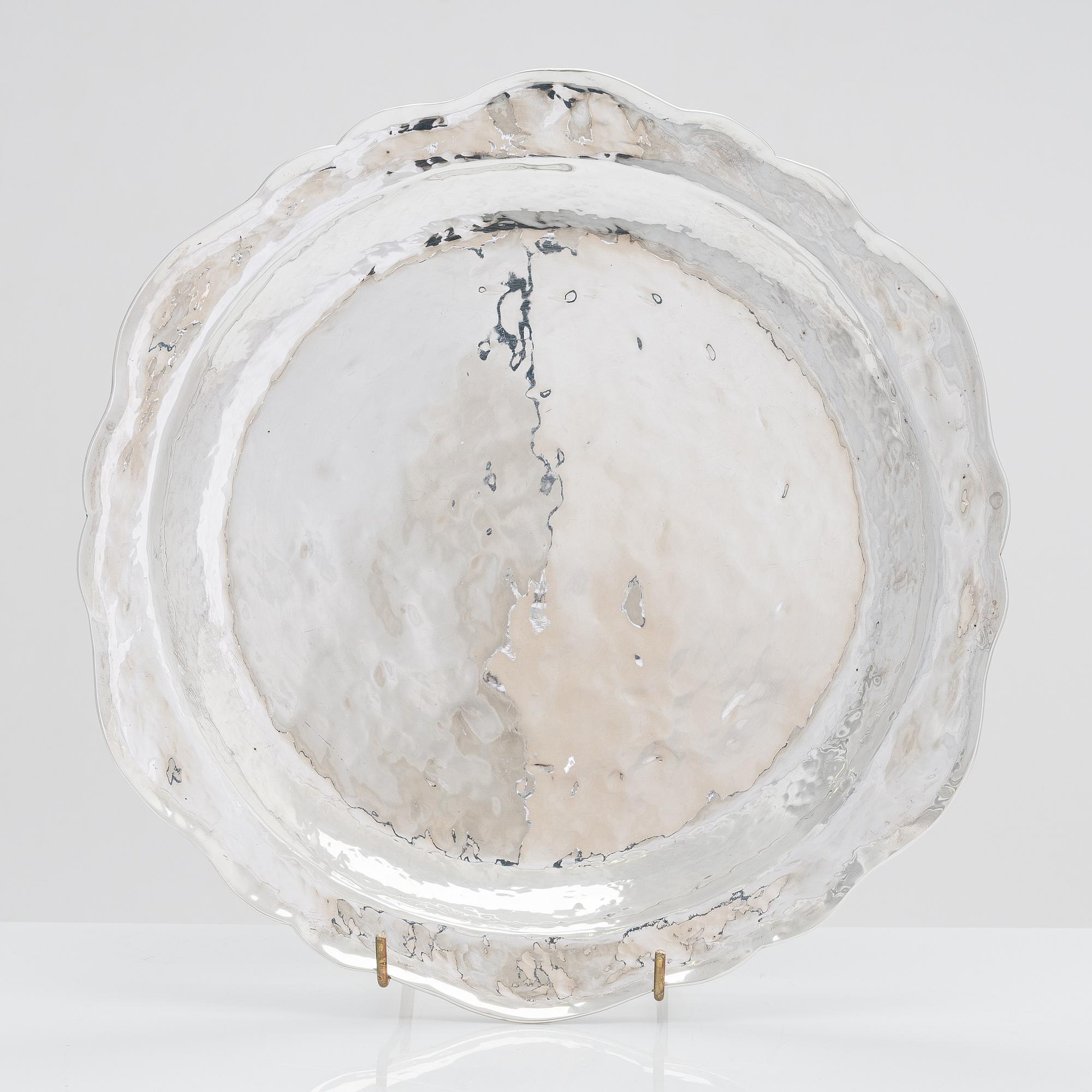 A 12-piece set of sterling silver chargers, Peru 1950s-60s.