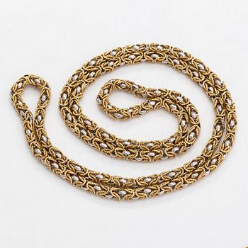 An 18K white and yellow gold necklace. Switzerland.