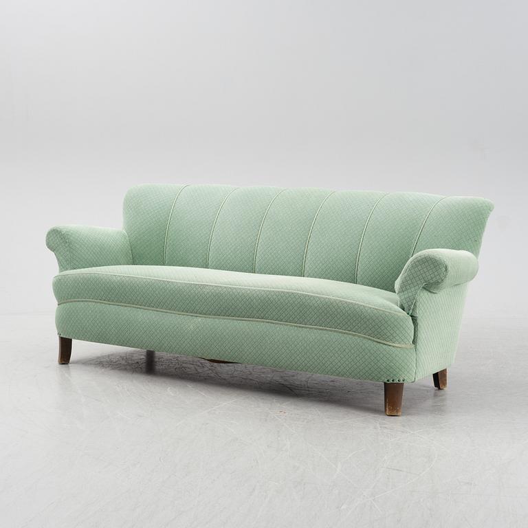 A mid 20th Century sofa and easy chair.